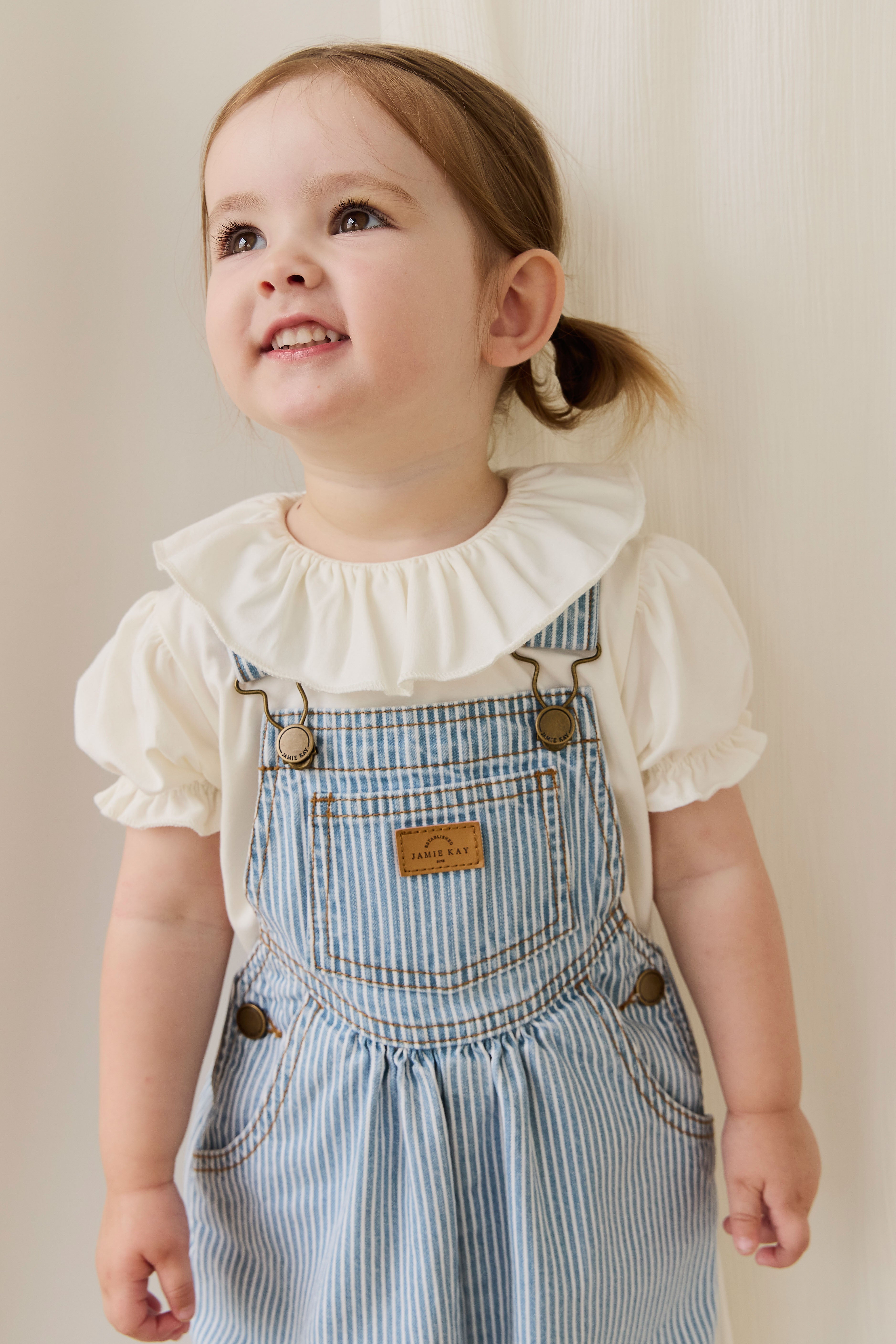Salopette classique à rayures de Noël en mélange de coton avec bretelles réglables et boutons-pression pour enfants de 6 mois à 8 ans