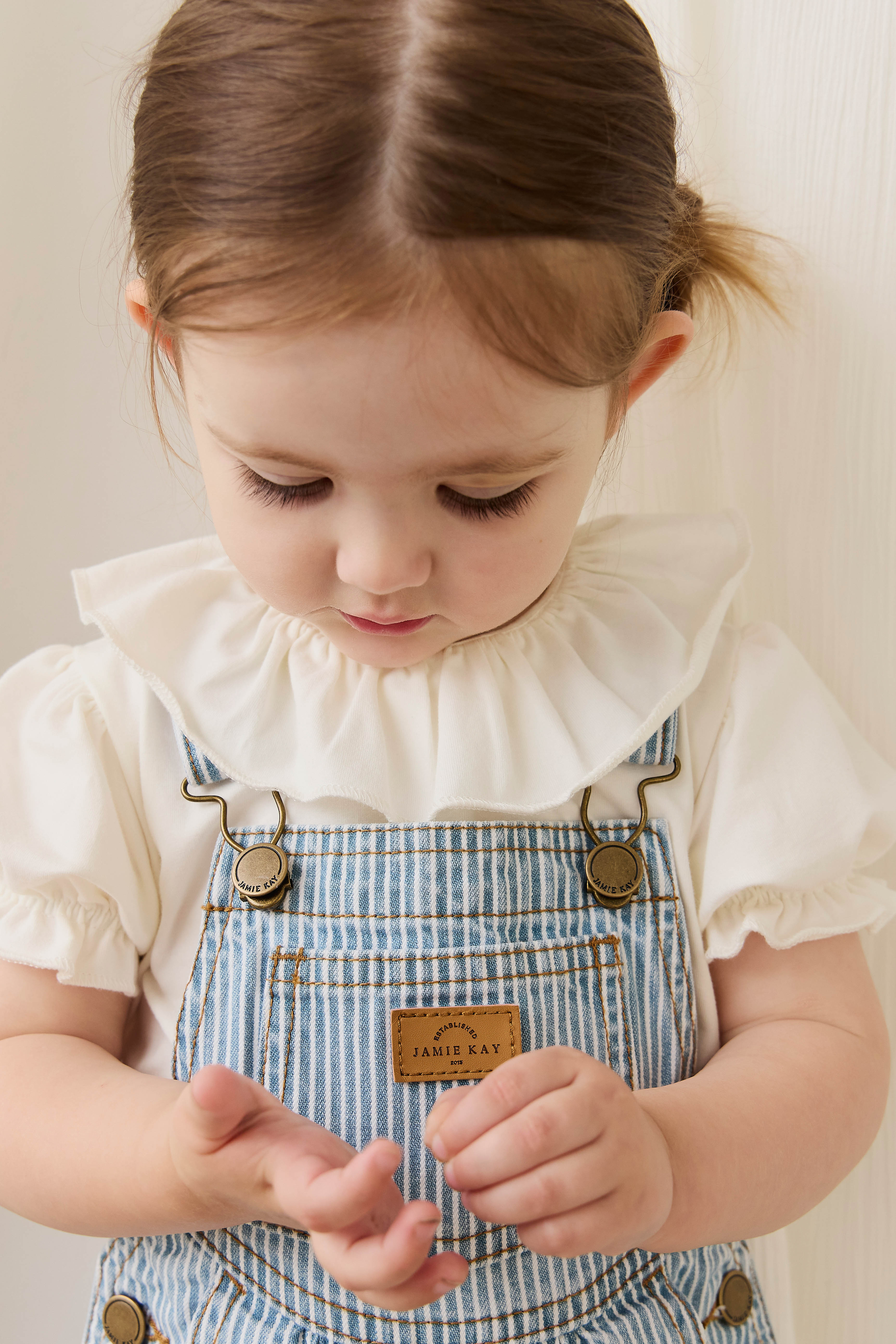 Salopette classique à rayures de Noël en mélange de coton avec bretelles réglables et boutons-pression pour enfants de 6 mois à 8 ans