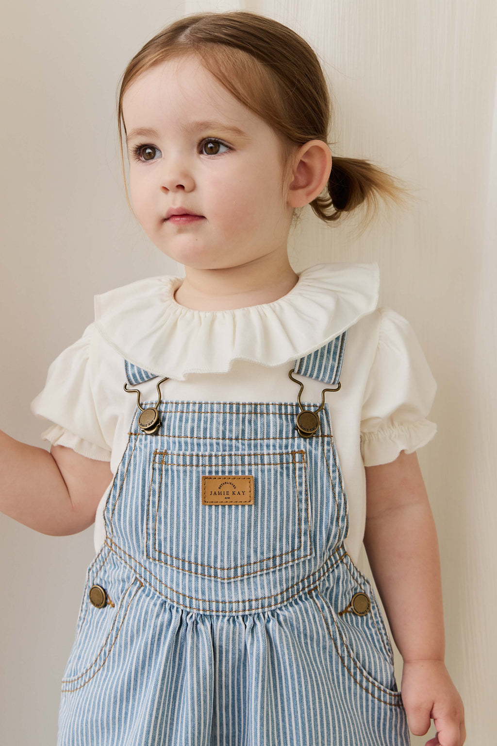 Salopette classique à rayures de Noël en mélange de coton avec bretelles réglables et boutons-pression pour enfants de 6 mois à 8 ans